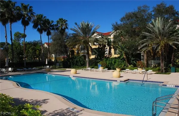 a view of a swimming pool with a lounge chair