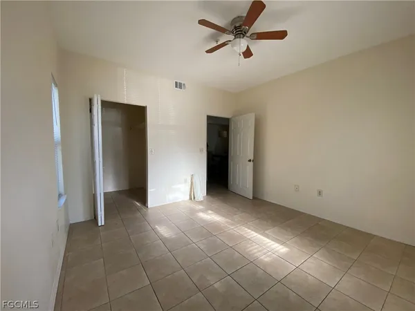 a view of an empty room and window