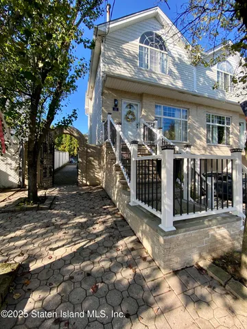 a view of a house with wooden deck