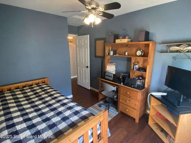 a bedroom with a bed and furniture