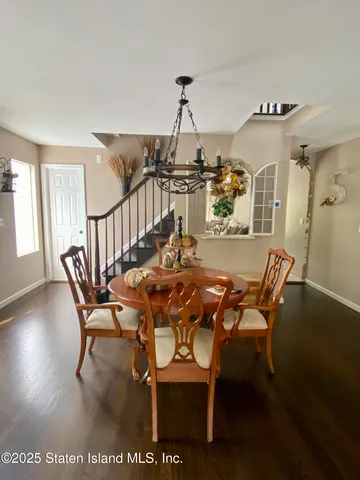 a view of a dining room with furniture and a window