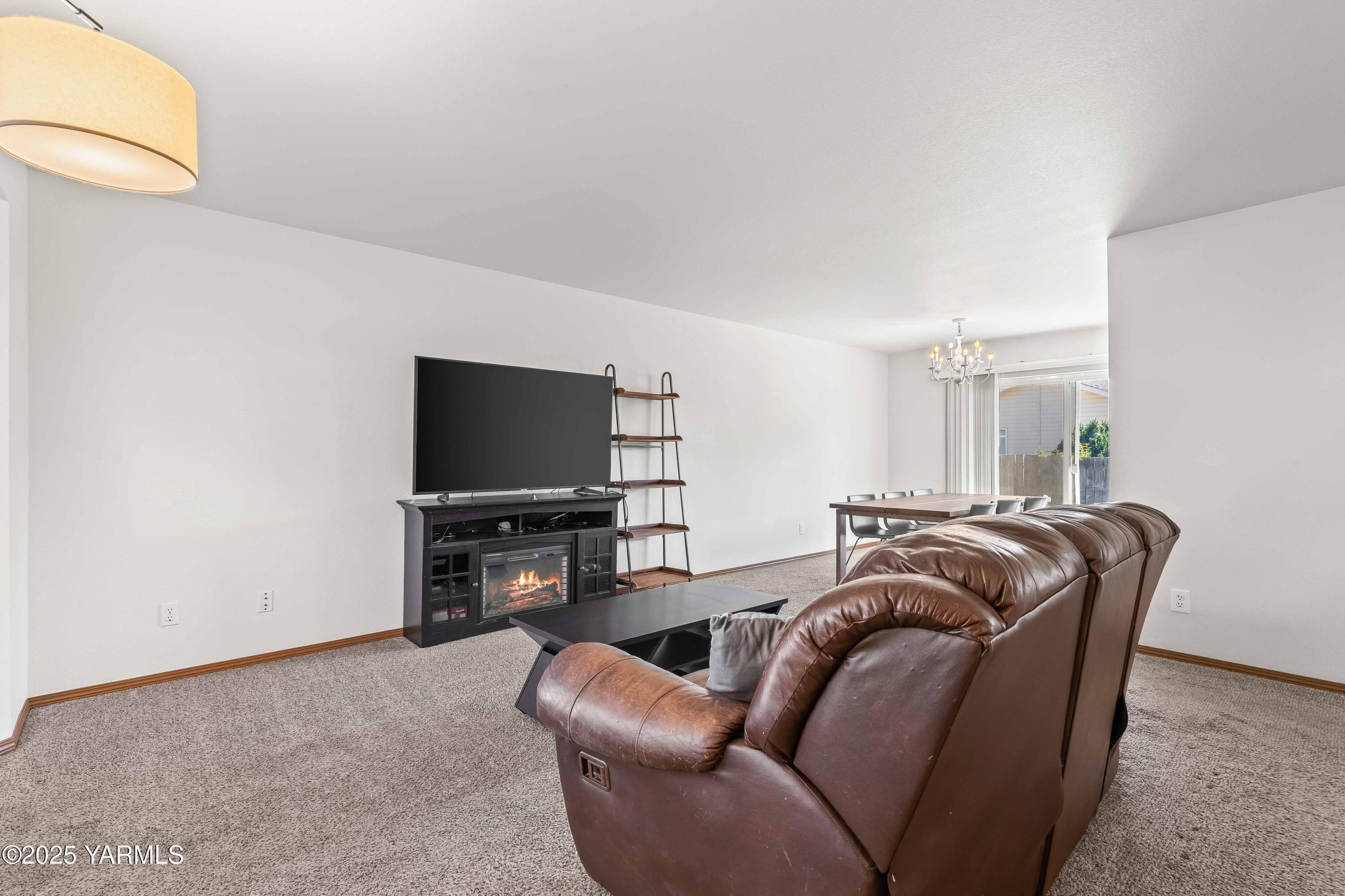 6508 Terry Avenue Yakima, WA 98908 - Photo 4 of 24 a living room with furniture and a flat screen tv