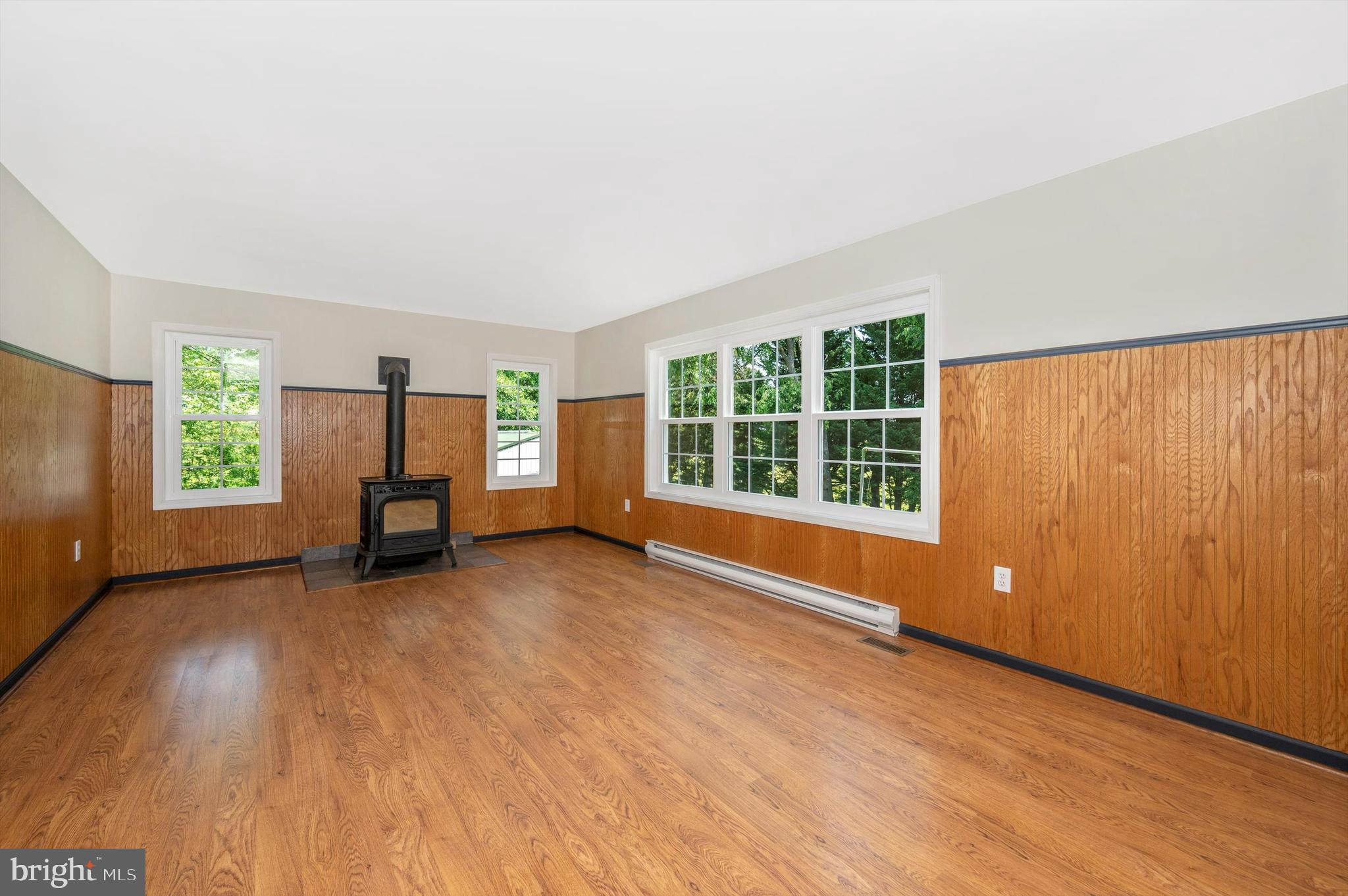 4737 Elmer Derr Road Frederick, MD 21703 - Photo 12 of 66 Family room w/pellet stove & replacement windows