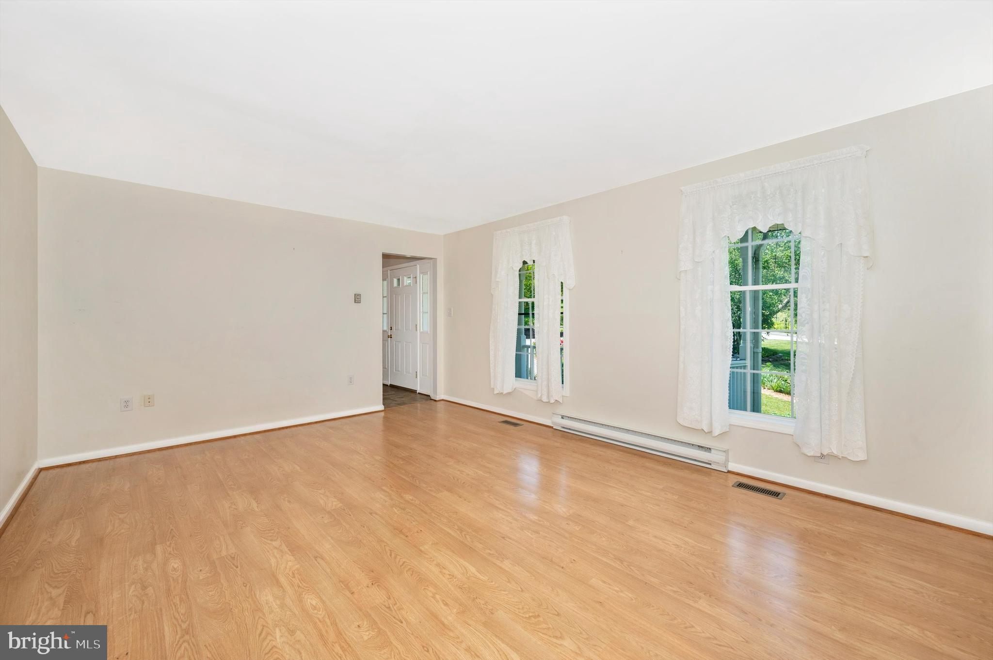 4737 Elmer Derr Road Frederick, MD 21703 - Photo 8 of 66 Formal living room w/laminate floors