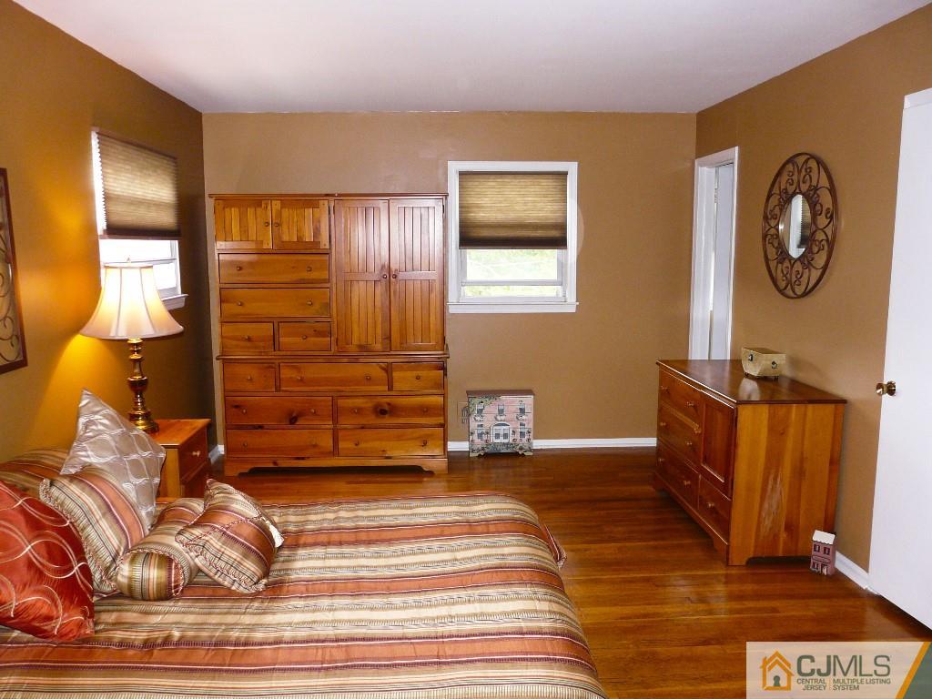 90 Drake Road Somerset, NJ 08873 - Photo 11 of 20 a view of a hallway with entryway wooden floor and front door