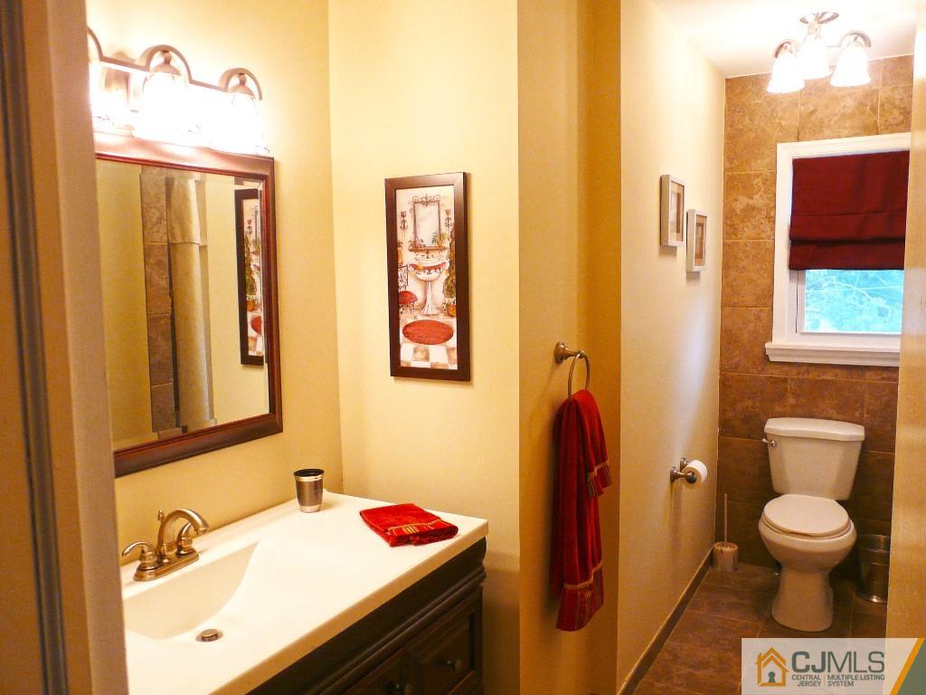 90 Drake Road Somerset, NJ 08873 - Photo 13 of 20 a bathroom with a sink toilet and shower