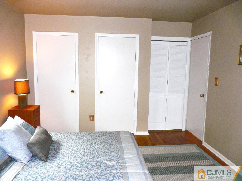 90 Drake Road Somerset, NJ 08873 - Photo 15 of 20 a bedroom with a bed and a lamp