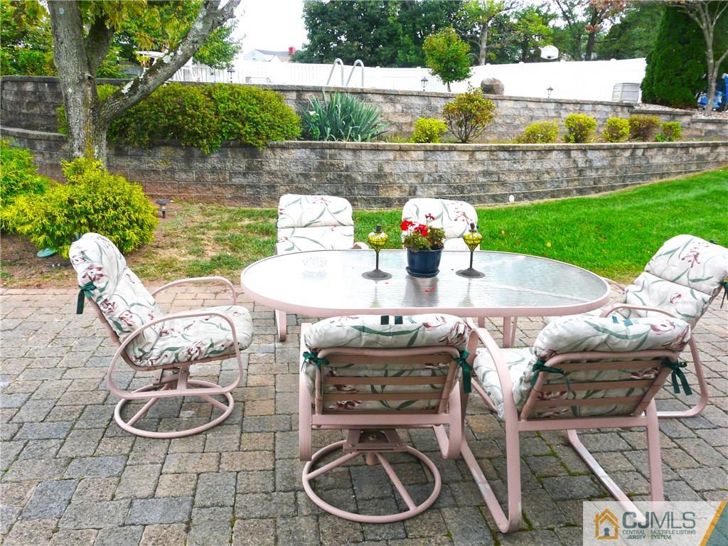 90 Drake Road Somerset, NJ 08873 - Photo 18 of 20 a table and chairs sitting on a wooden floor