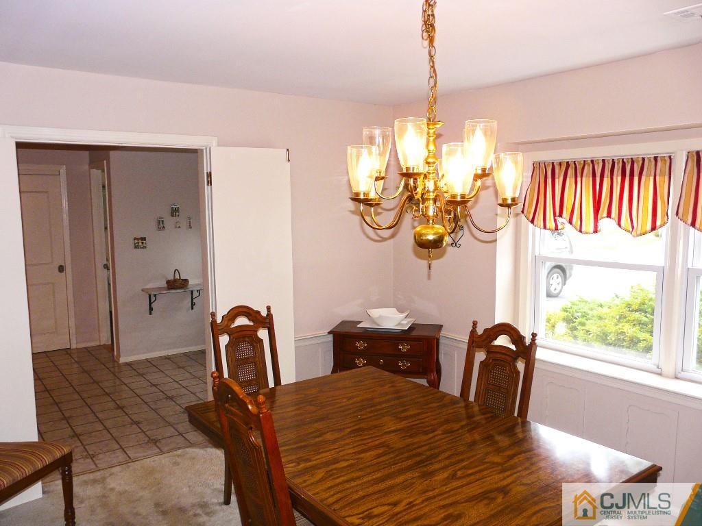 90 Drake Road Somerset, NJ 08873 - Photo 6 of 20 a view of a dining room with furniture window and outside view