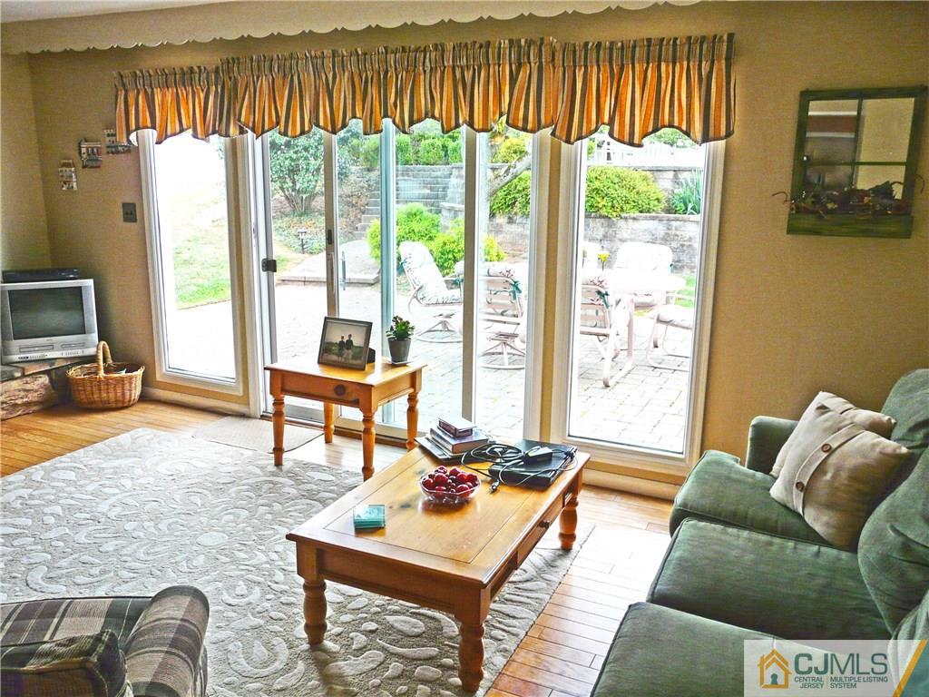 90 Drake Road Somerset, NJ 08873 - Photo 9 of 20 a living room with furniture and a floor to ceiling window