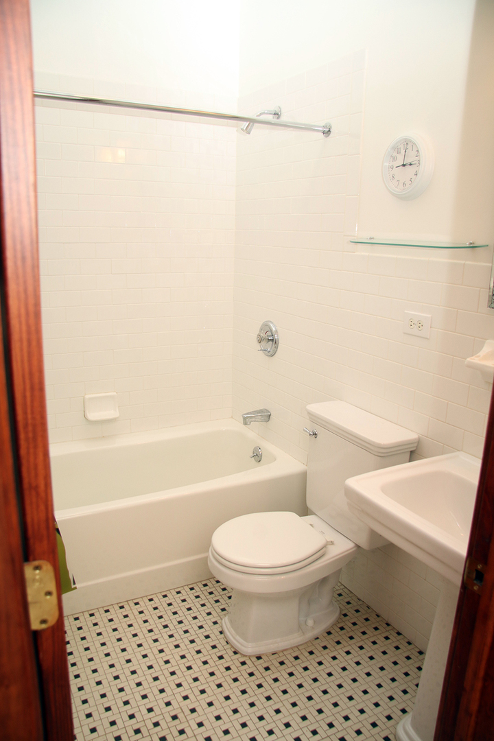857 West Newport Avenue, Unit 3 Chicago, IL 60657 - Photo 15 of 19 a bathroom with a toilet and a shower