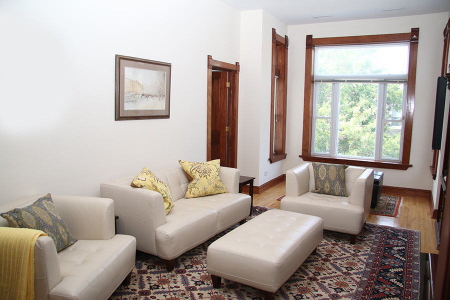 857 West Newport Avenue, Unit 3 Chicago, IL 60657 - Photo 2 of 19 a living room with furniture and a window