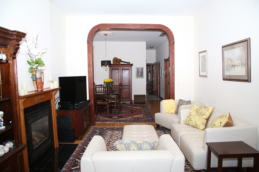 857 West Newport Avenue, Unit 3 Chicago, IL 60657 - Photo 3 of 19 a living room with furniture and a flat screen tv