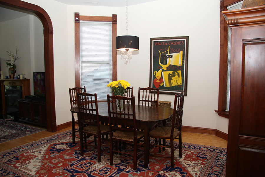857 West Newport Avenue, Unit 3 Chicago, IL 60657 - Photo 4 of 19 a view of a dining room with furniture and chandelier