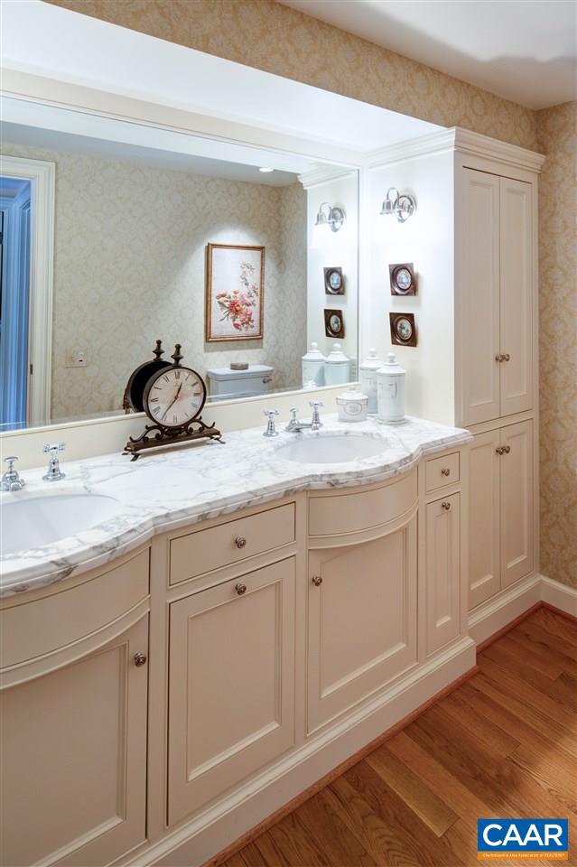 1314 Rugby Road Charlottesville, VA 22903 - Photo 32 of 50 a en suite bathroom with double sink and a mirror