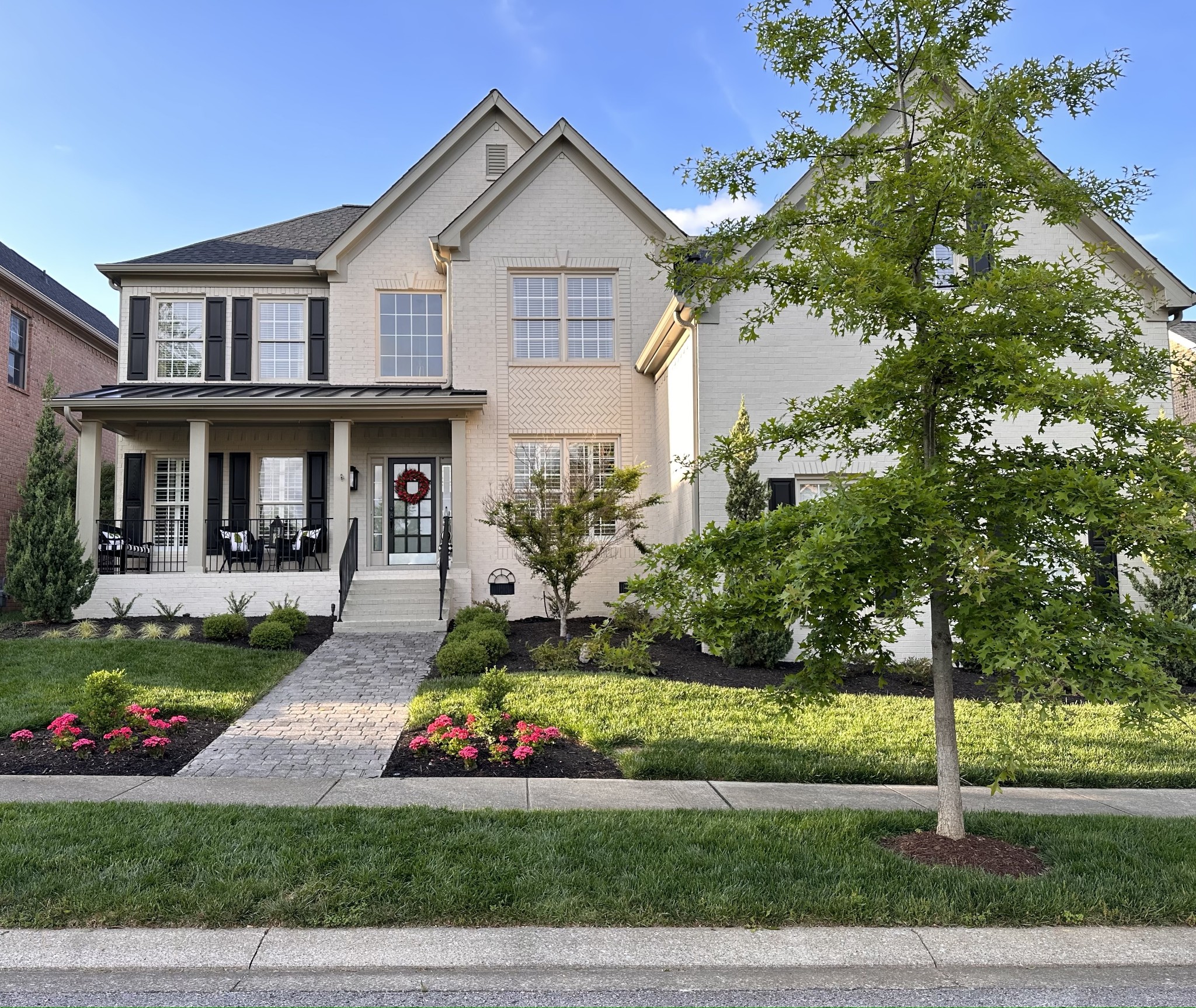a front view of a house with a yard