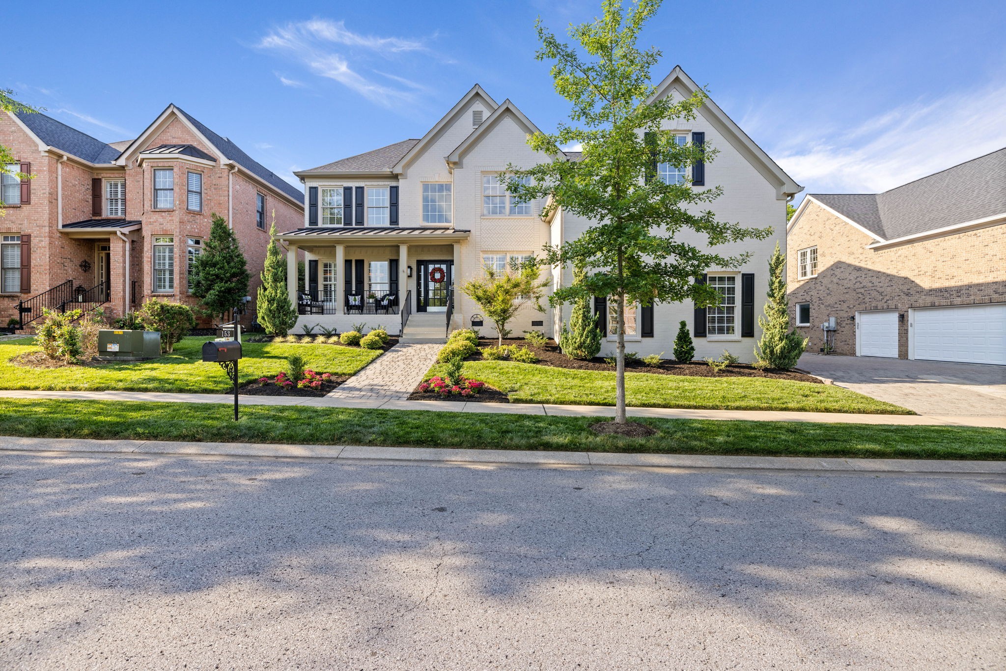 153 Cornerstone Circle Franklin, TN 37064 - Photo 2 of 70 a front view of a house with a yard and garage