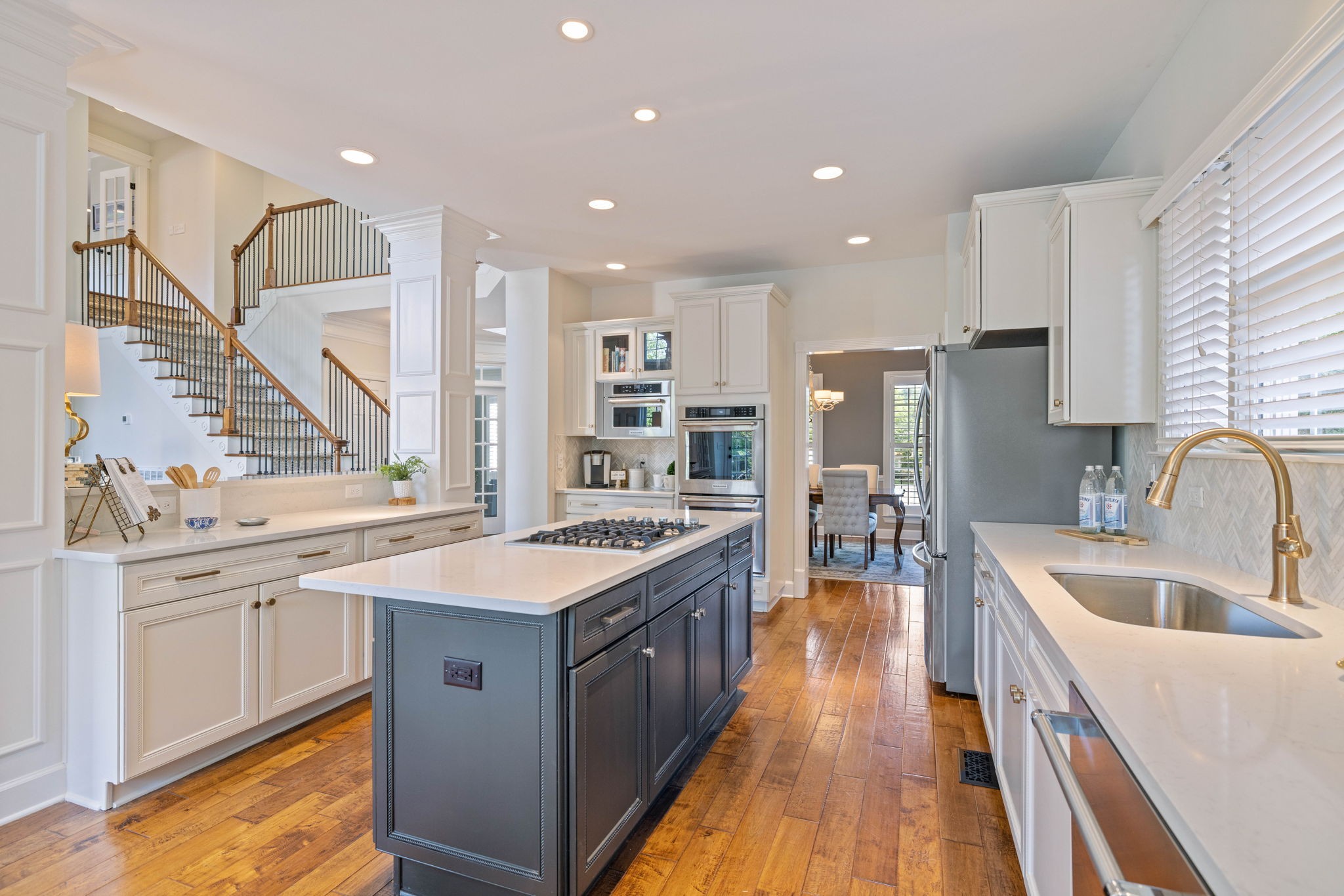 153 Cornerstone Circle Franklin, TN 37064 - Photo 24 of 70 a kitchen with stainless steel appliances granite countertop a sink stove and refrigerator