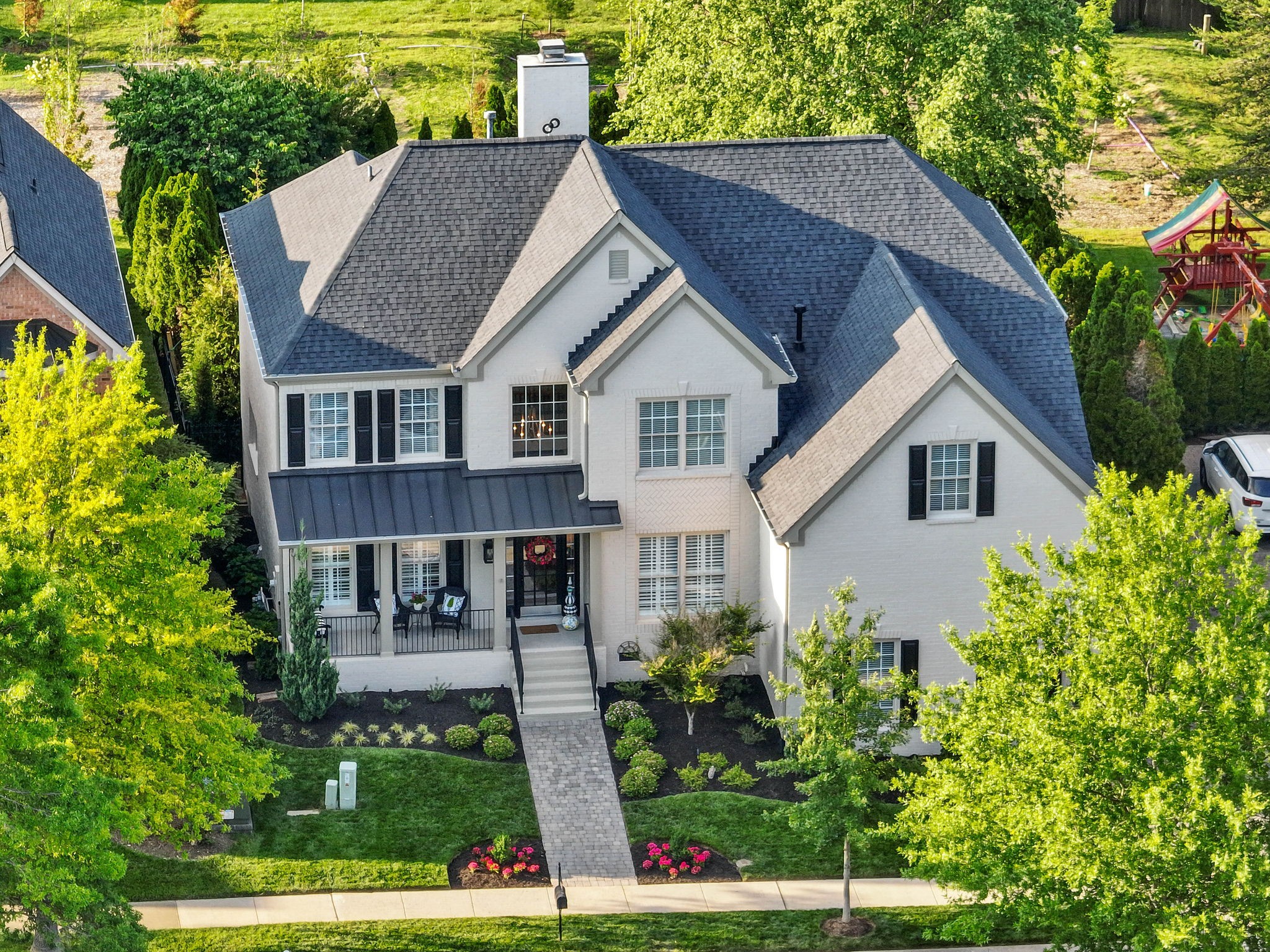 153 Cornerstone Circle Franklin, TN 37064 - Photo 3 of 70 a view of house with garden and tall tree