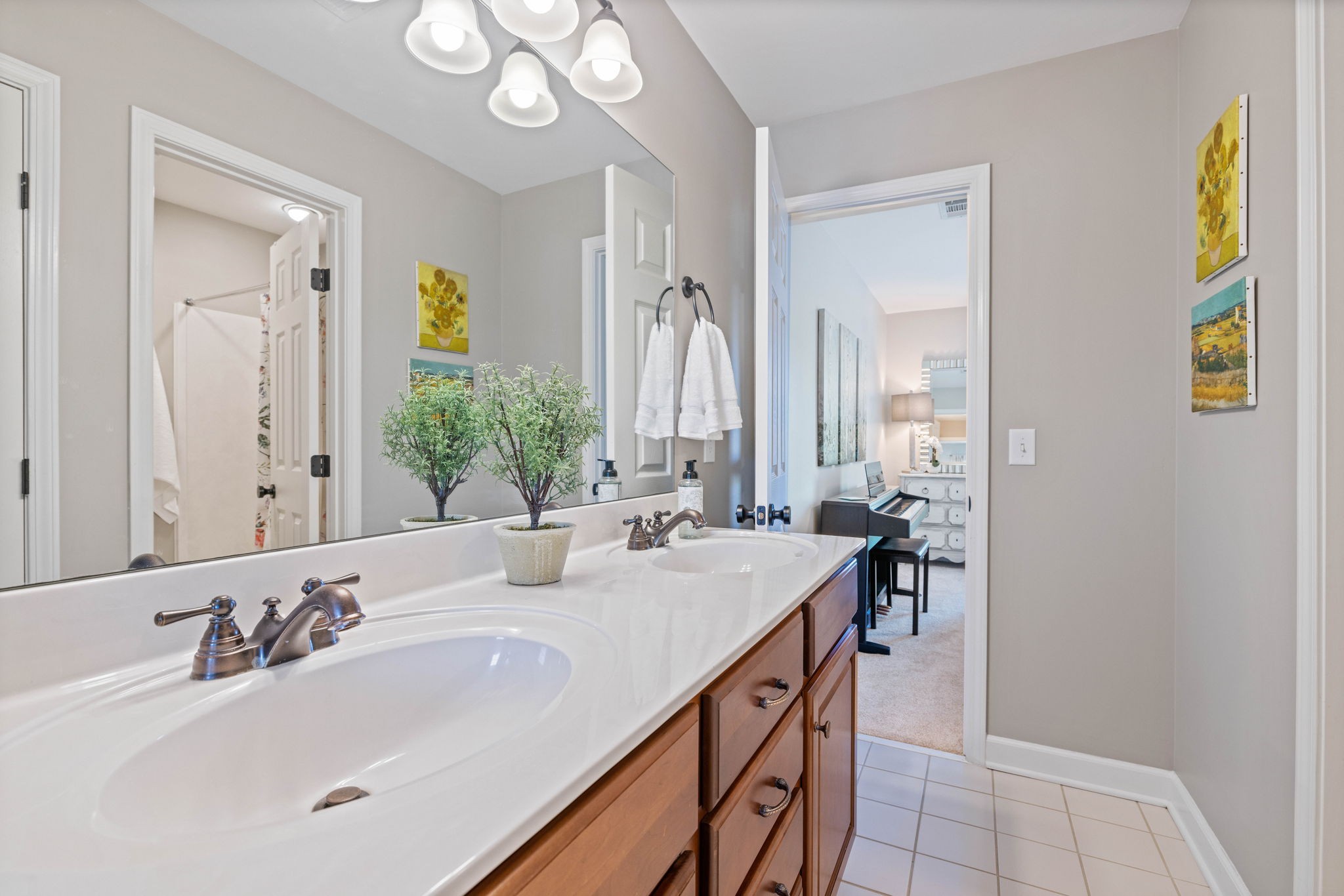 153 Cornerstone Circle Franklin, TN 37064 - Photo 48 of 70 a bathroom with a double vanity sink and a mirror