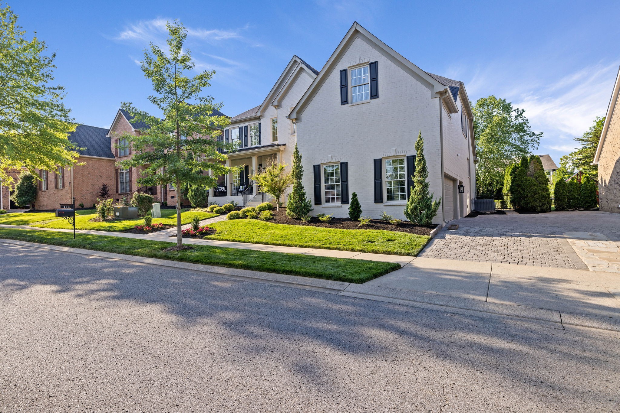 153 Cornerstone Circle Franklin, TN 37064 - Photo 5 of 70 a view of a house with a small yard and large trees