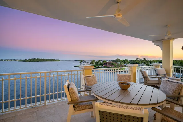 a view of swimming pool with outdoor seating and plants
