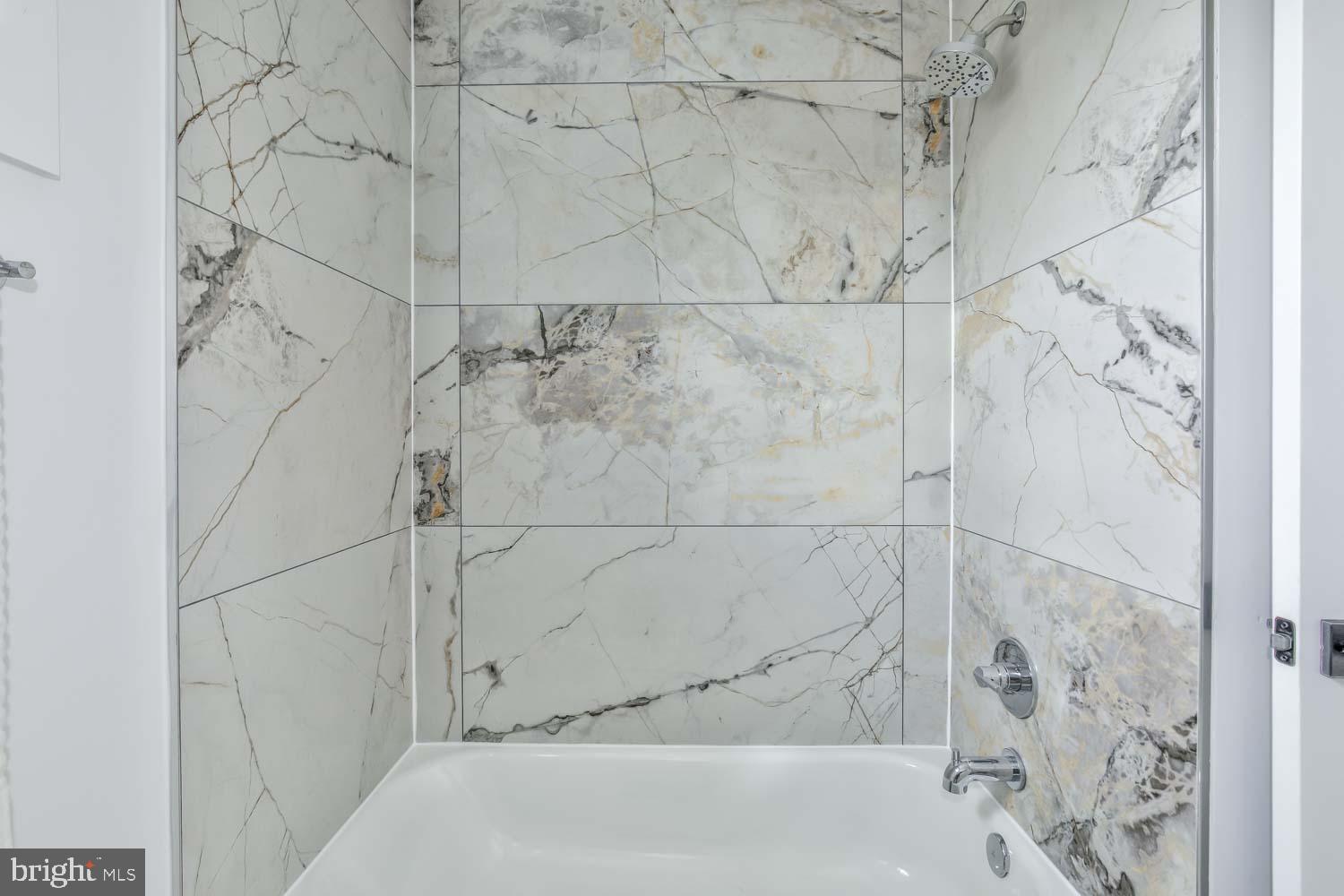 4347 Harrison Street Northwest, Unit 7 Washington, DC 20015 - Photo 15 of 28 a bathroom with a bathtub