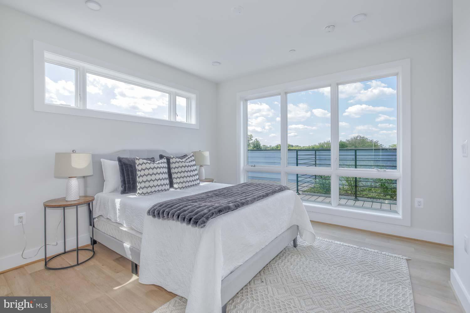 4347 Harrison Street Northwest, Unit 7 Washington, DC 20015 - Photo 18 of 28 a bedroom with a bed and a large window