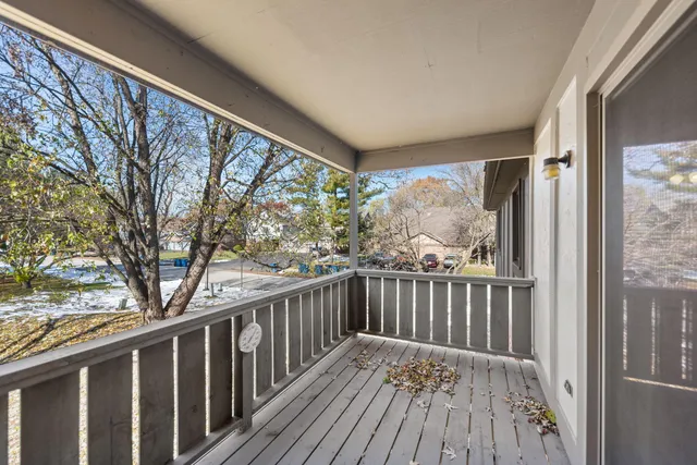 a view of balcony with wooden floor