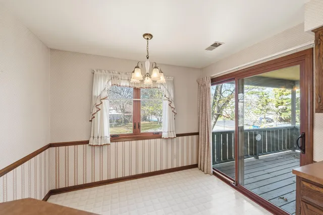 a view of a balcony with wooden floor