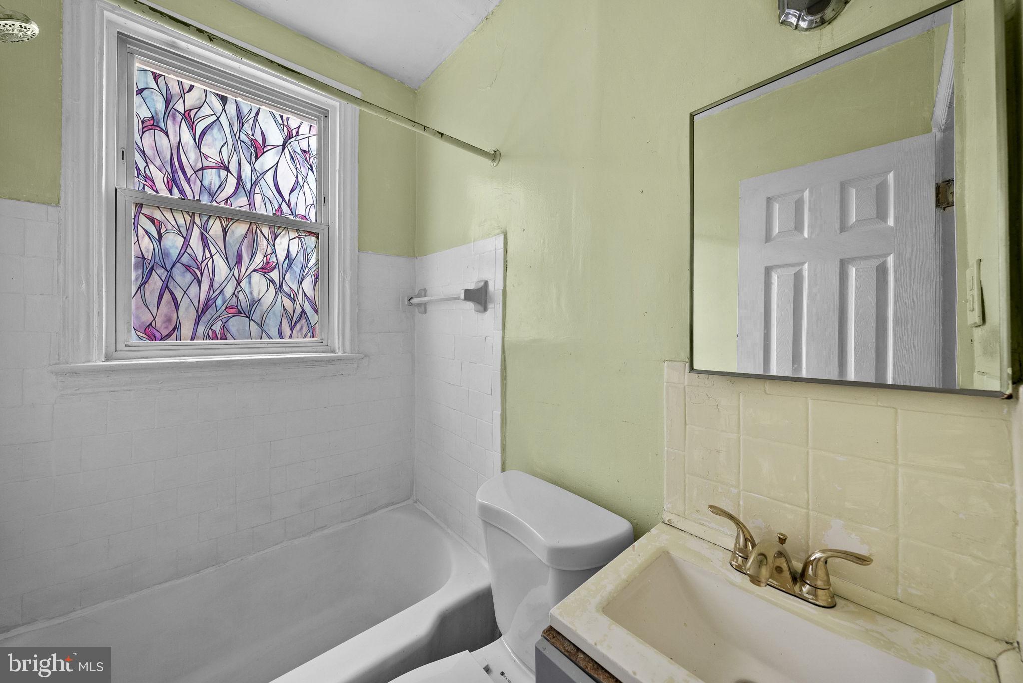 1942 Capitol Avenue Northeast Washington, DC 20002 - Photo 13 of 24 a bathroom with a sink and a bathtub
