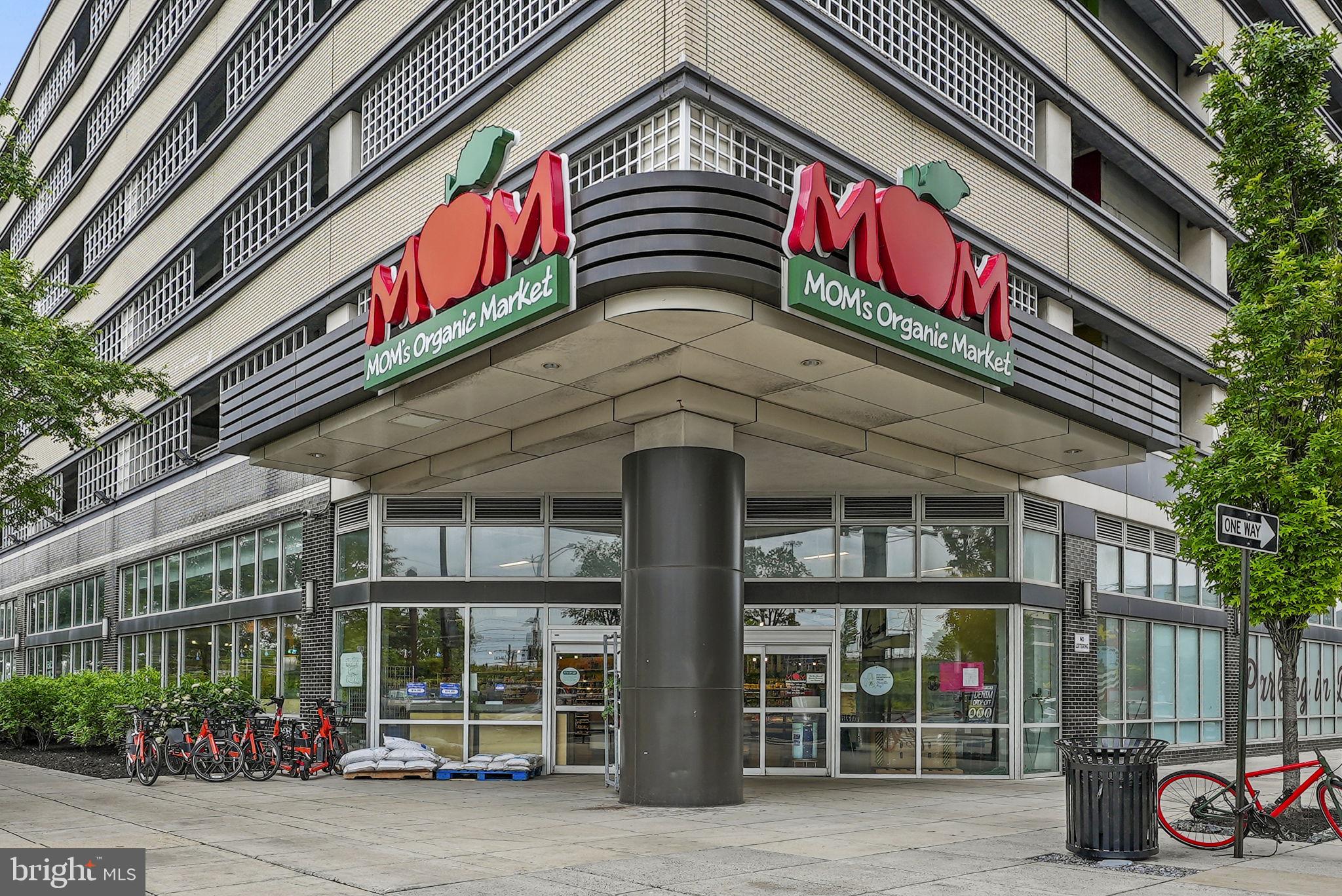 1942 Capitol Avenue Northeast Washington, DC 20002 - Photo 19 of 24 a front view of multi story residential apartment building with retail shops