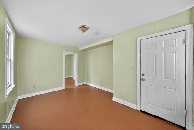 an empty room with closet area