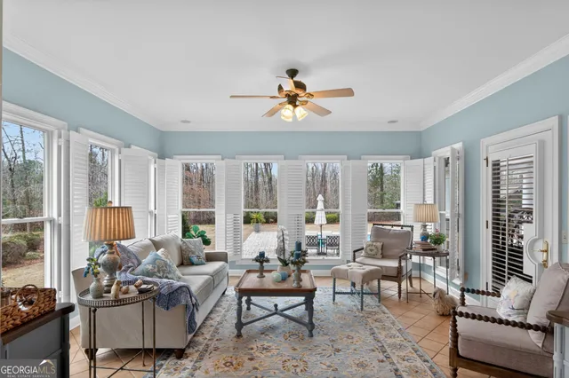 a bedroom with furniture and a chandelier
