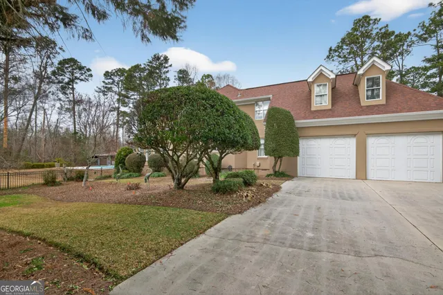 an aerial view of a house with outdoor space