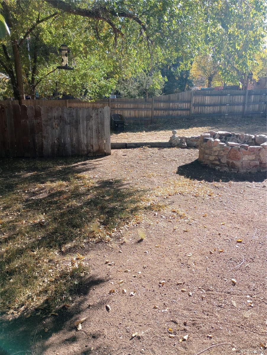 111 Crystal Park Road, Unit 1 Manitou Springs, CO 80829 - Photo 26 of 28 a backyard of a house with lots of green space