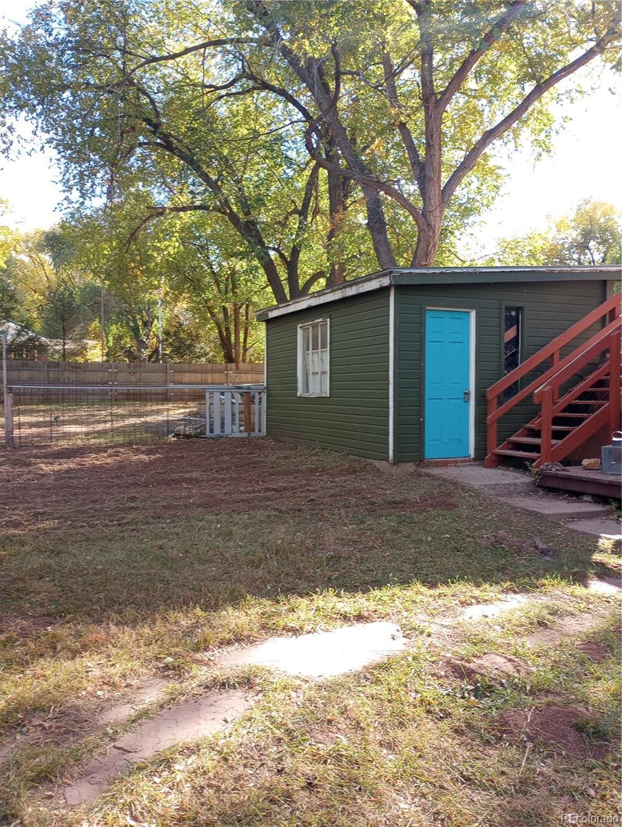 111 Crystal Park Road, Unit 1 Manitou Springs, CO 80829 - Photo 27 of 28 a view of a house with a yard