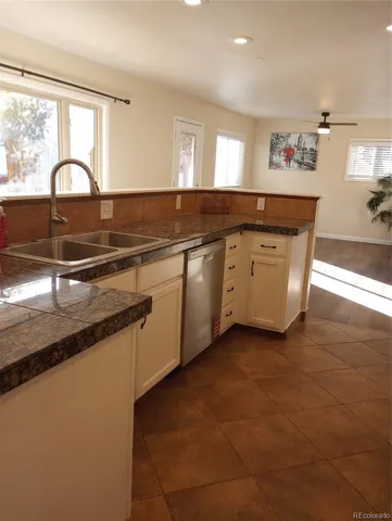 a kitchen with a sink and cabinets