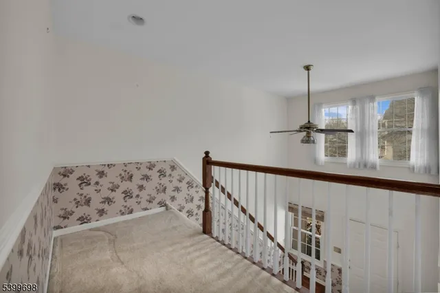 a view of a hallway with windows