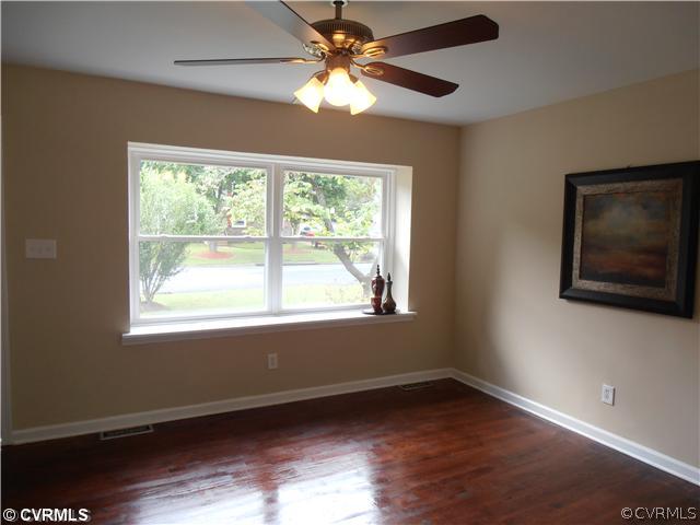 6316 Barrister Road Chesterfield, VA 23832 - Photo 3 of 12 a view of an empty room with wooden floor and a window