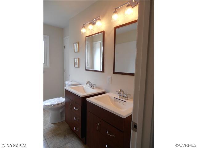 6316 Barrister Road Chesterfield, VA 23832 - Photo 7 of 12 a bathroom with a sink toilet and mirror