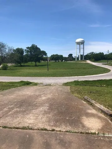 a view of a golf course with a lake
