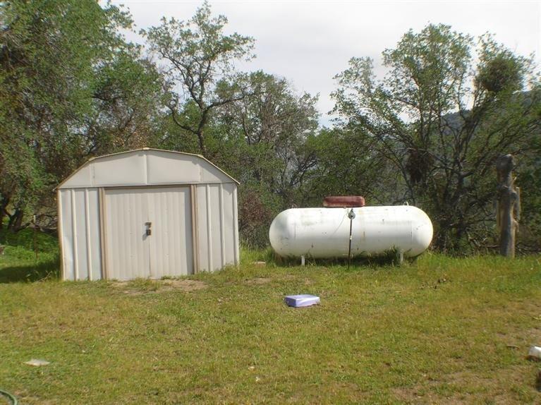 47560 Creekside Road Squaw Valley, CA 93675 - Photo 22 of 23 storage shed and 495 gallon propane tank