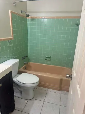 a bathroom with a sink a toilet and bathtub