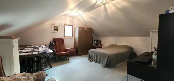 a living room with furniture and flat screen tv