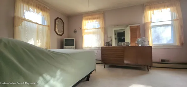 a view of a living room and dining area