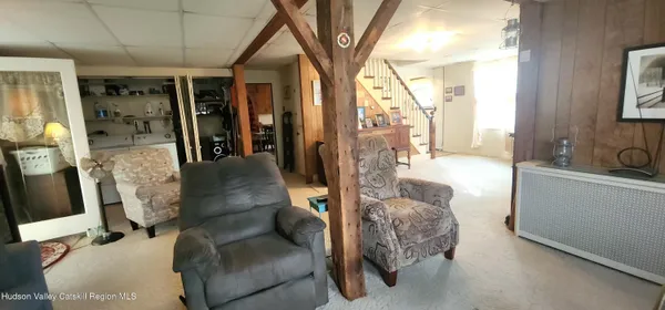 a kitchen with stainless steel appliances kitchen island granite countertop furniture a refrigerator and a sink