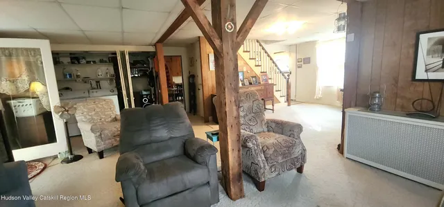 a kitchen with stainless steel appliances kitchen island granite countertop furniture a refrigerator and a sink