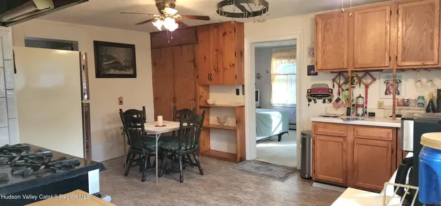 a bathroom with a sink toilet and window