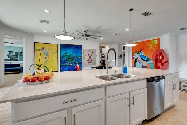 a bedroom with a bed and painting on the wall